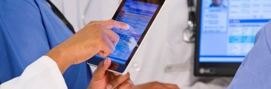 Medical workers with tablet and computer 